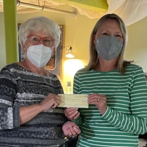 Artist Linda Smith presented a check for $780 to Elaine McGillivray, the LVCC host for the event.